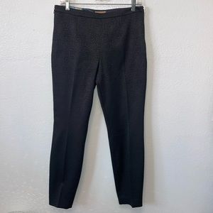 Ted Baker London black slacks/ side zipper on each side. Textured leopard print